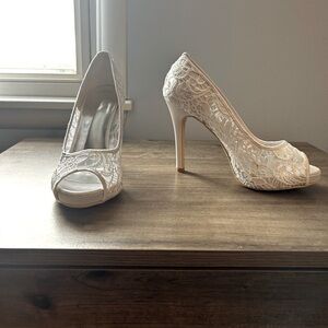 Women’s heels. White mesh. Never worn, but tags have been removed.